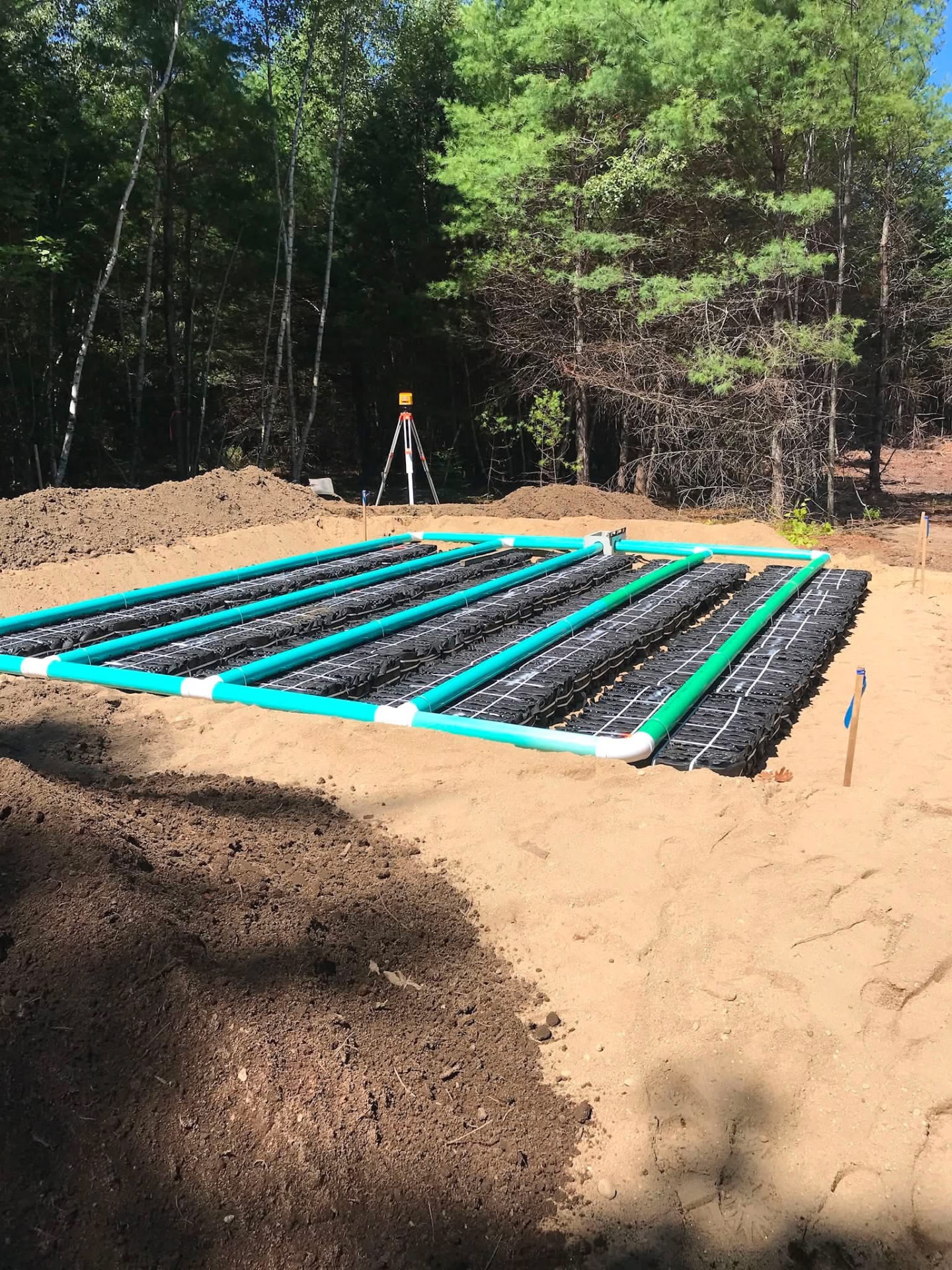 New septic system leach field with chambers and distribution piping installed in Southern Maine